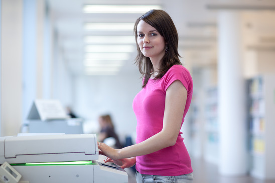 Woman using a photocopier