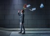 businessman throwing away files and documents