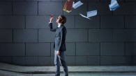 businessman throwing away files and documents